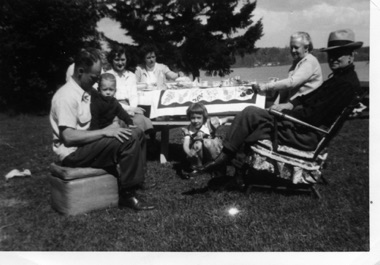 Elizabeth (Jones) O'Boyle  took this at Bill's lake home in May.  Tom hidden behind Bill with Randy.  Ellene, Anita Bess, Pha, and Sandy